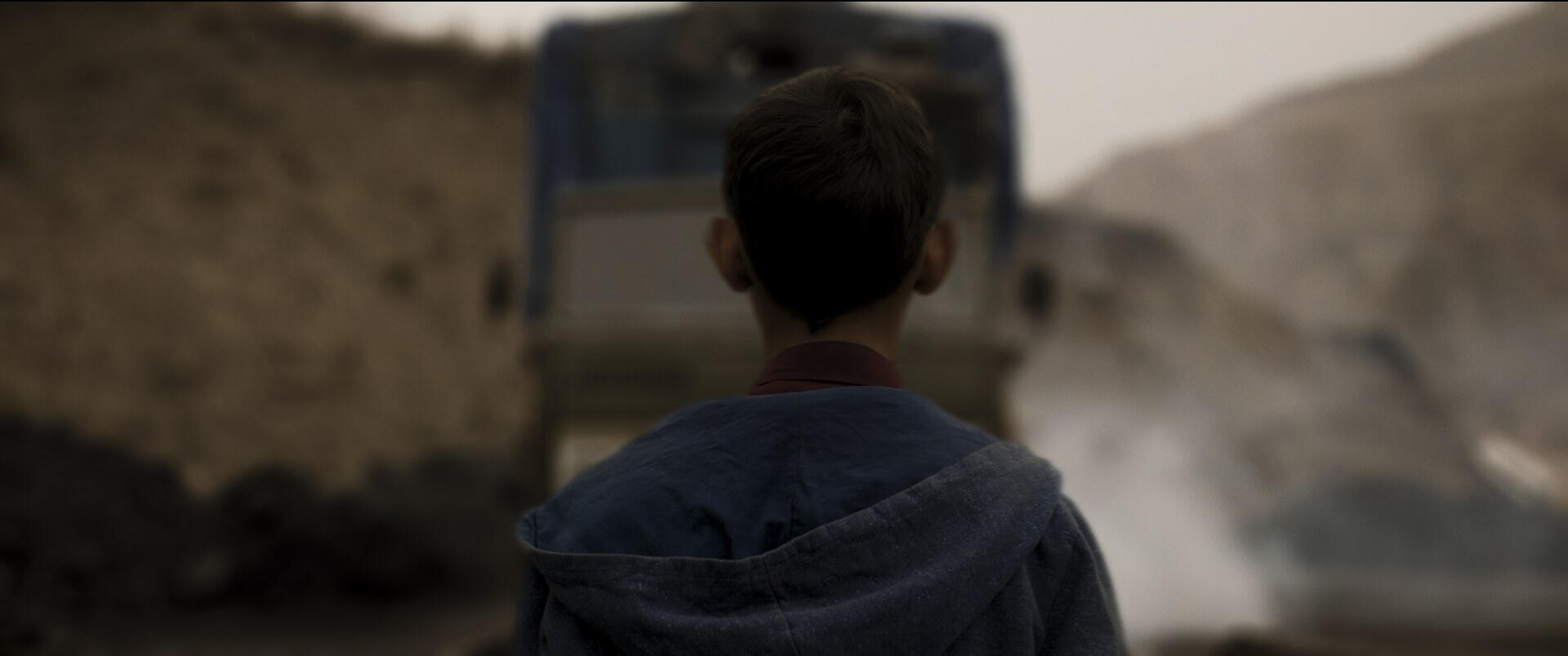 Boy facing the truck Boy facing the truck